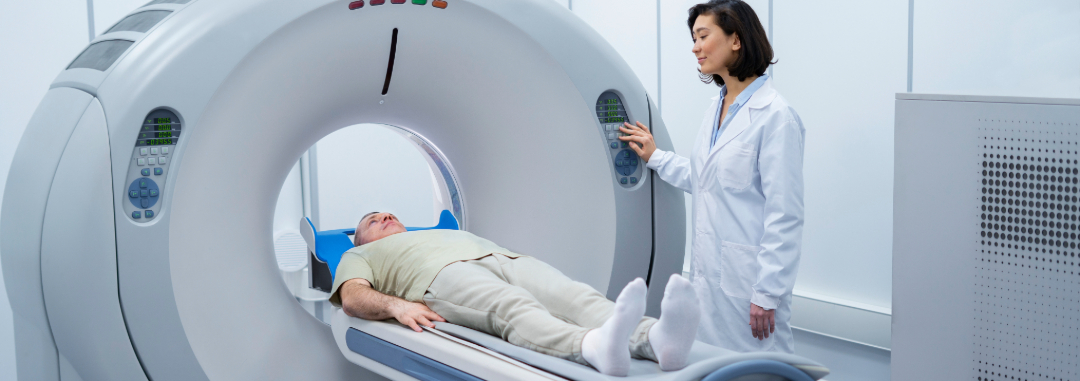 Doctor preparing patient for a CT Scan